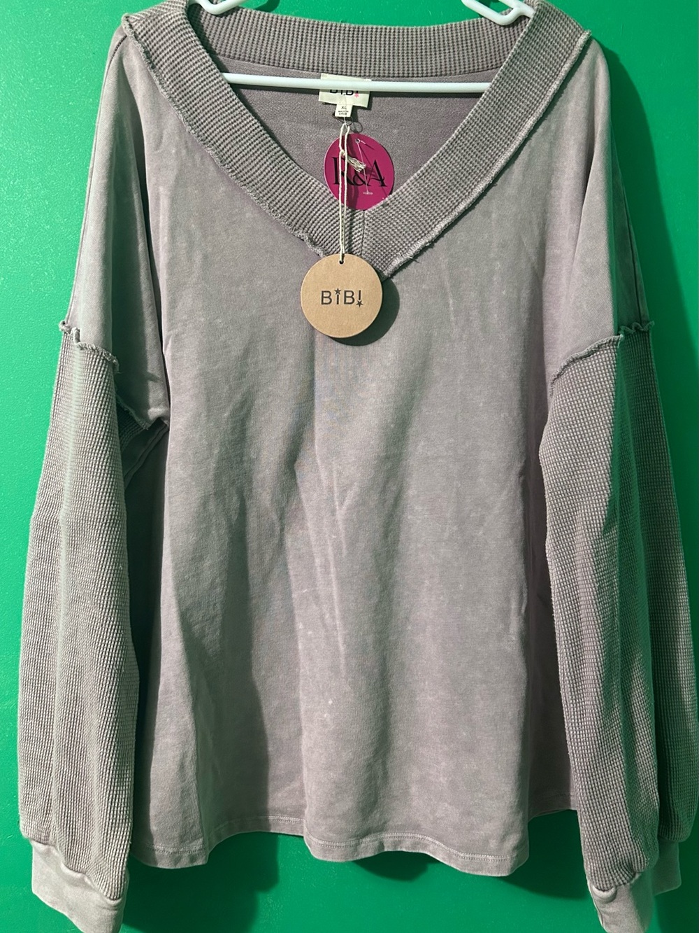 Women’s BIBI boutique Textured Sleeve V-Neck Pullover new with tags